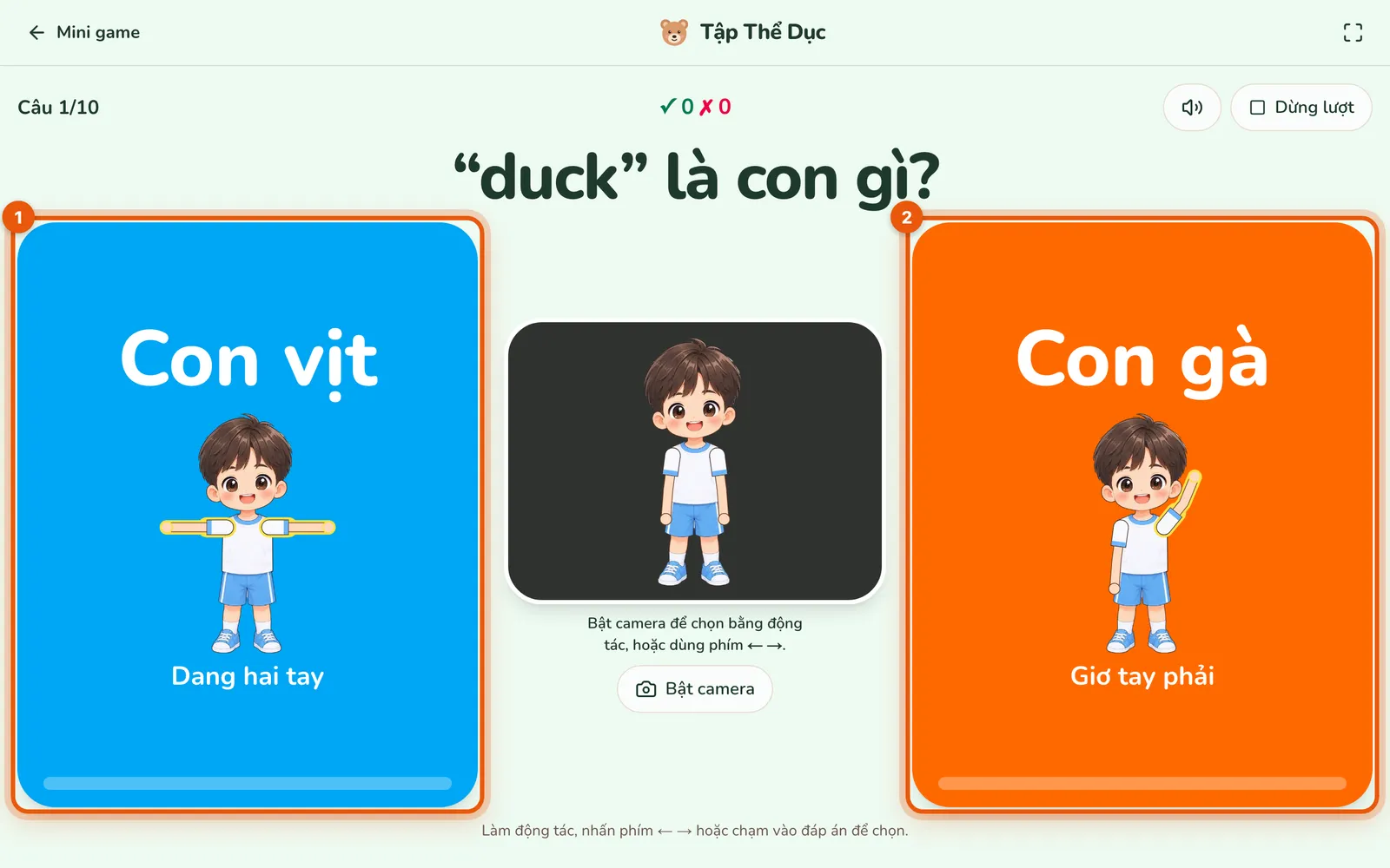Màn chơi Tập Thể Dục ở câu “duck” là con gì?: thẻ Con vịt bên trái và thẻ Con gà bên phải có số thứ tự, mỗi thẻ có hình bạn nhỏ làm mẫu và tên động tác; khung camera ở giữa đang tắt.